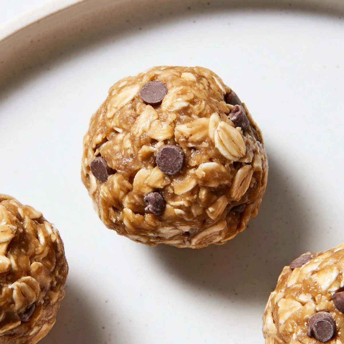 No-Bake Peanut Butter Energy Balls, studded with mini chocolate chips, ready to eat and enjoy.
