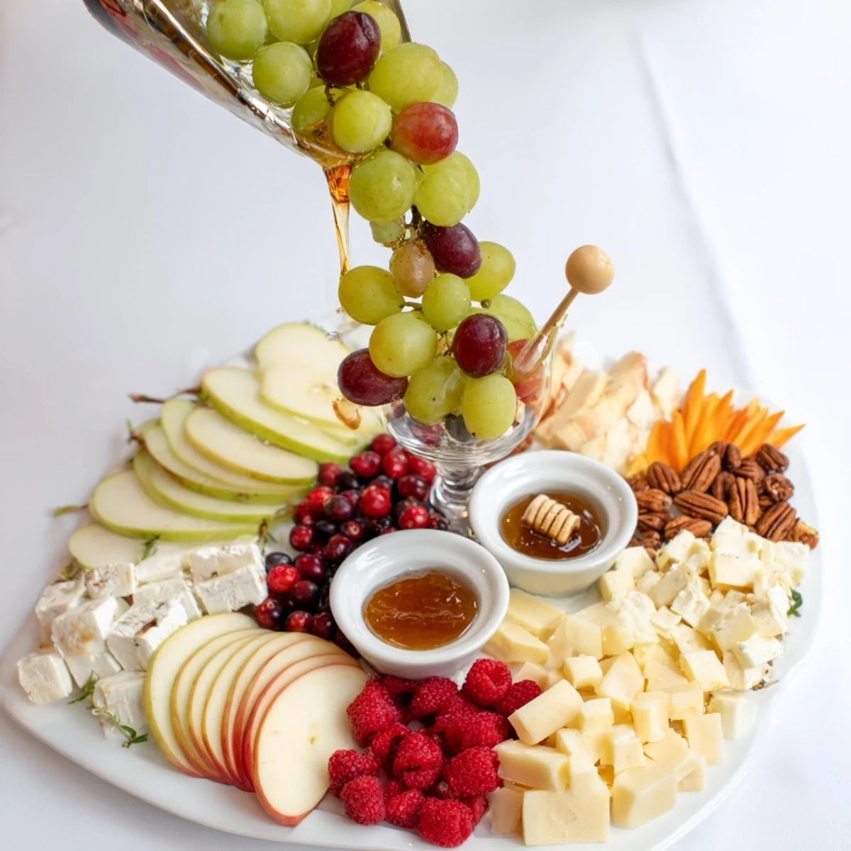 Festive Champagne Waterfall Board, a gorgeous appetizer with cascading fruit and cheese, ideal for celebrations.