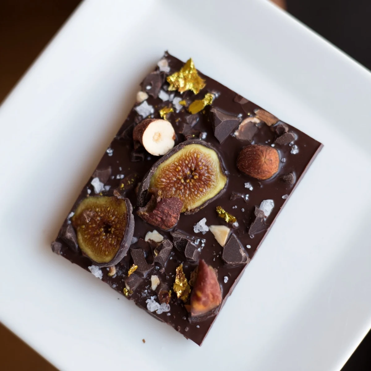 Midnight Mosaic dessert, showcasing a dark chocolate base with fig and olive mosaic topping.