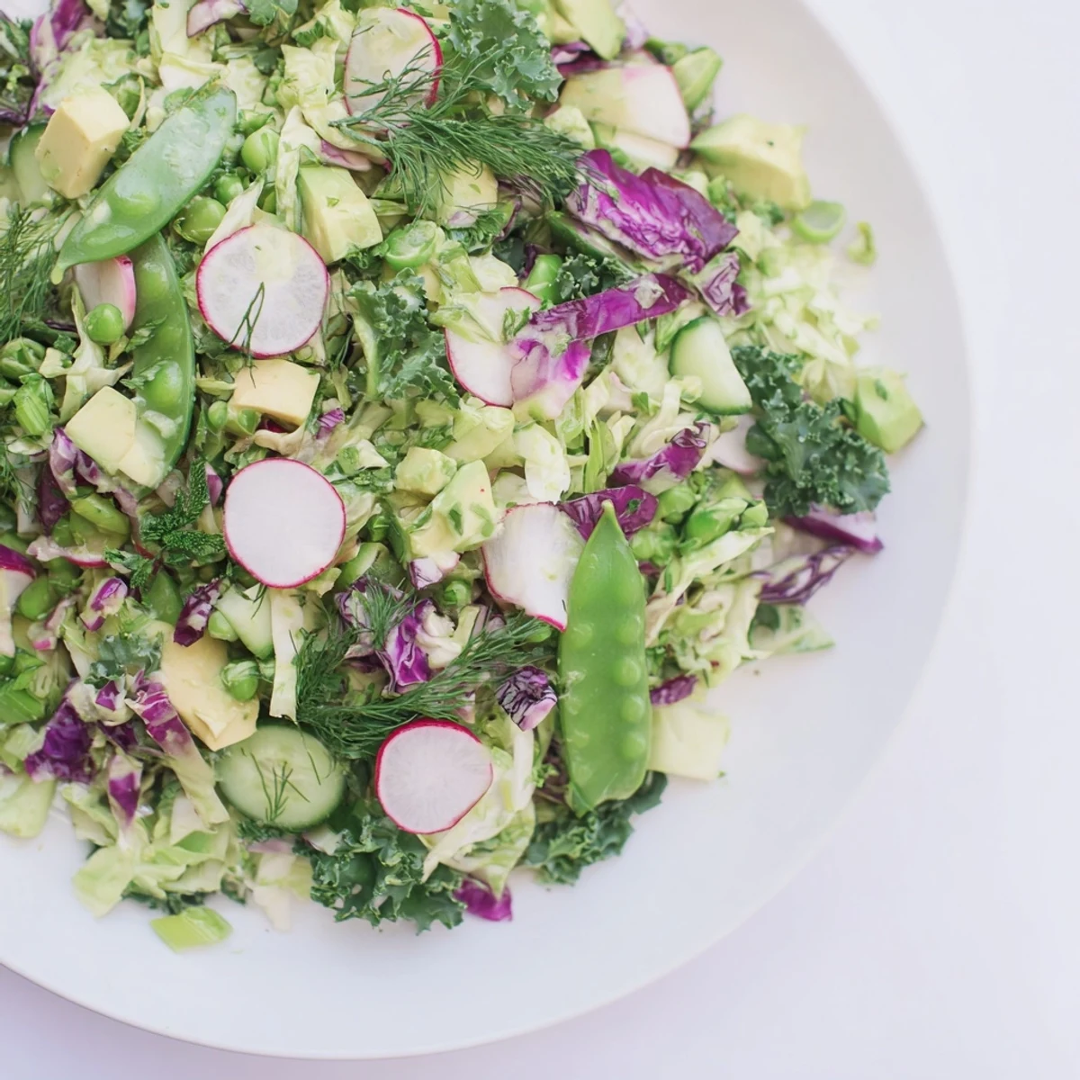 Vibrant Green Goddess Detox Cabbage Salad with crisp veggies and a tangy lemon dressing for a healthy meal.
