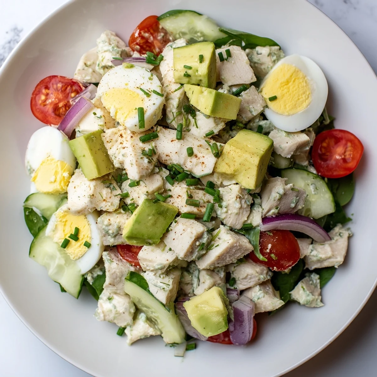 This High-Protein Chicken and Egg Salad features tender chicken and eggs with a tangy dressing, perfect meal prep.
