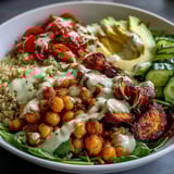 Fresh cucumber and avocado slices add crisp texture to a colorful vegan dinner bowl.