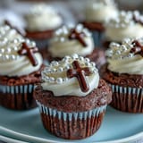 Delicate vanilla mini cupcakes with smooth buttercream and fondant rosary toppers, ideal for First Communion celebrations.