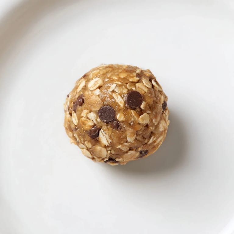 A close-up view of fresh No-Bake Peanut Butter Energy Balls, ideal for a quick, healthy snack on the go.