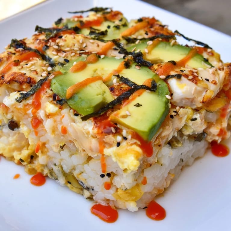 Warm, flavorful chicken sushi bake, perfect for sharing, with tender chicken and seasoned rice.