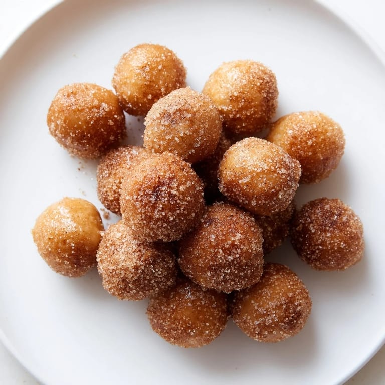 Close-up of freshly made Air Fryer Cinnamon Donuts, promising a quick and delightful dessert experience.