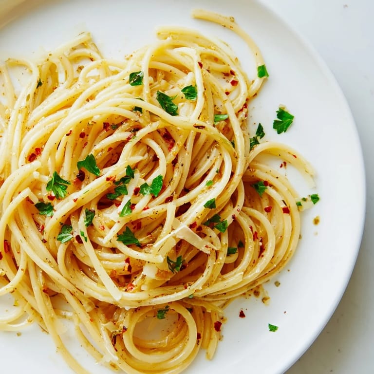 This quick and easy Aglio e Olio Express Pasta recipe features tender spaghetti coated in flavorful olive oil.