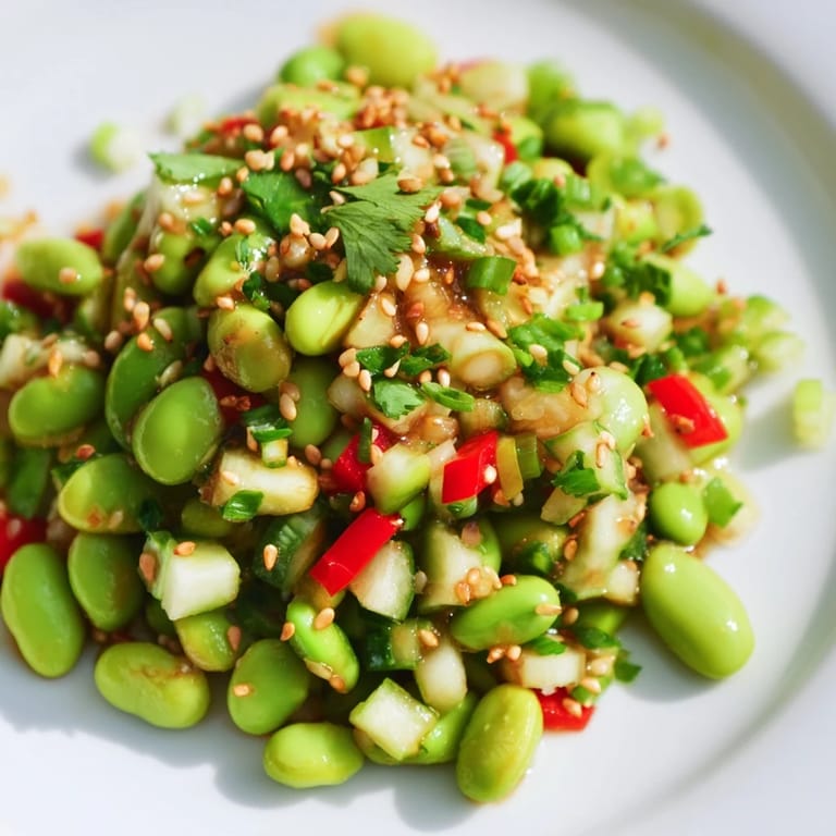 A bowl full of delicious Edamame Salad, featuring tender edamame and a savory ginger dressing.